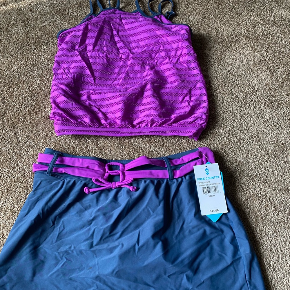 Selling a woman’s two piece purple and gray bathing suit